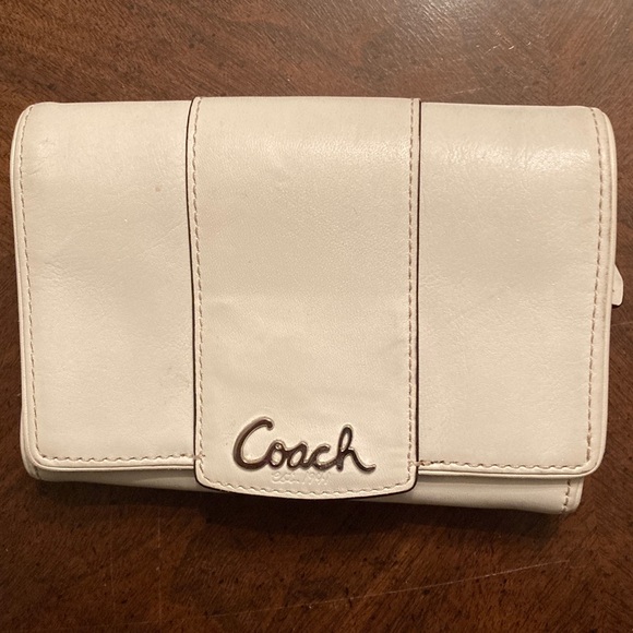 Coach Handbags - Coach EUC Penelope White Leather Clutch Wallet with Silver logo on front flap.